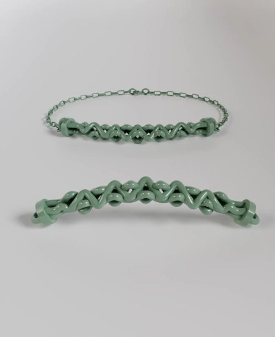 3D render of a pastel green bracelet with an intricate, interwoven or braided chain design, shown attached to a delicate chain and detached from multiple angles.