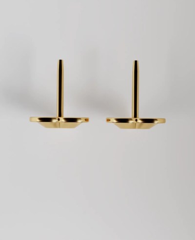 Top view of Pair of 18k yellow gold stud earrings, featuring a faceted, geometric heart shape.