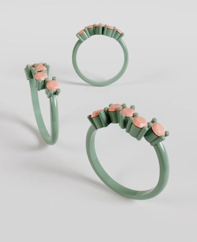 3D render of a pastel green ring, featuring five round peach colored gemstones set in prongs in a wavy arrangement along the top of the band, shown from multiple angles.