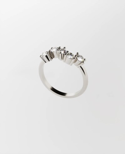 18k white ring, featuring five round clear diamonds set in prongs in a wavy arrangement along the top of the band.