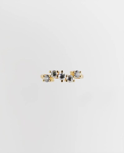 Top view of a 18k yellow gold ring, featuring five round clear diamonds set in prongs in a wavy arrangement along the top of the band.